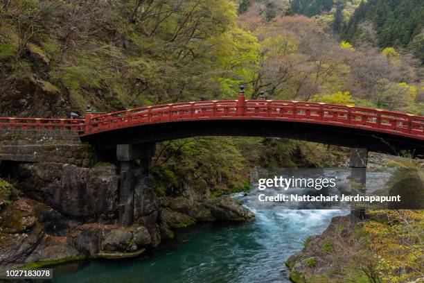 red historic bridge at nikko , the famous travel destination of cultured trip - präfektur tochigi stock-fotos und bilder