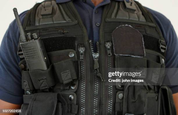 a security officer dressed vest - bullet proof vest stock pictures, royalty-free photos & images