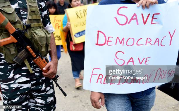 Poster that says, save democracy save freedom press is seen during the protest. Media persons marched for their rights and freedom in the northeast...