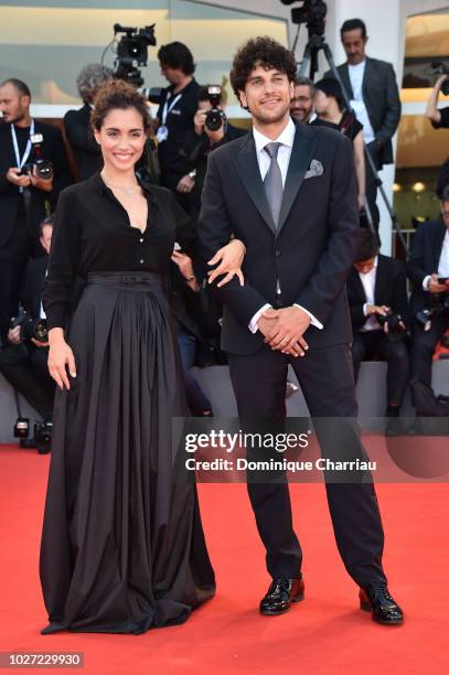 Emanuele Scamardella and Cristiana Dell'Anna walk the red carpet ahead of the '22 July' screening during the 75th Venice Film Festival at Sala Grande...