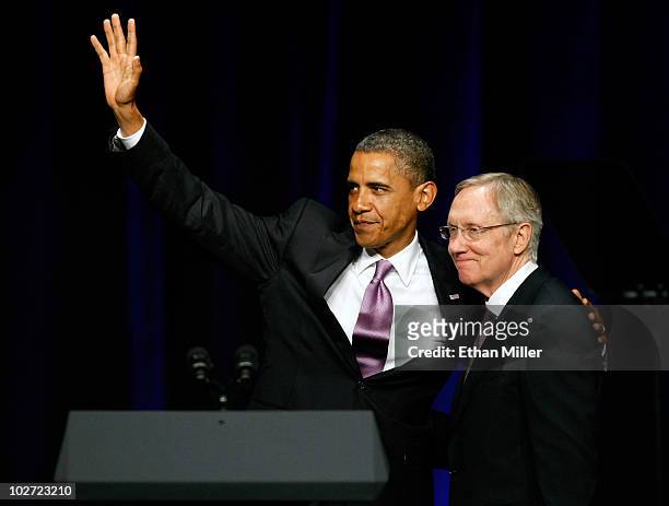 President Barack Obama waves as he is introduced by U.S. Senate Majority Leader Harry Reid during a campaign rally for Reid at the Aria Resort &...