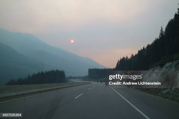 Smoke from forest fires blocks sunlight in the wilderness on August 22, 2018 in British Columbia, Canada. Over 500 forest fires in the province have...
