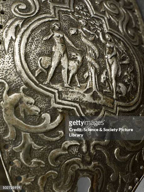 Metal chastity belt, 15th to 16th century. Metal chastity belt, consisting of two panels hinged together, richly decorated. 15th-16th century. Grey...