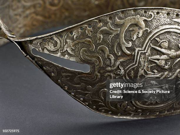 Metal chastity belt, 15th to 16th century. Metal chastity belt, consisting of two panels hinged together, richly decorated, registered. 15th-16th...