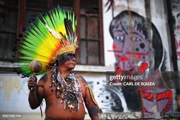 Native Korubo Isolado, from the Brazilian state of Acre, poses at the abandoned and crumbling Indian Museum complex, near the National Museum where...
