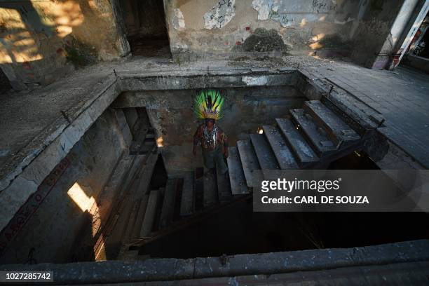 Native Korubo Isolado, from the Brazilian state of Acre, poses at the abandoned and crumbling Indian Museum complex, near the National Museum where...