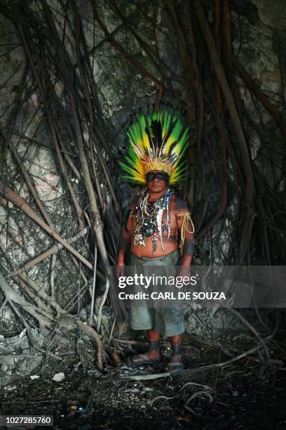 Native Korubo Isolado, from the Brazilian state of Acre, poses at the abandoned and crumbling Indian Museum complex, near the National Museum where...