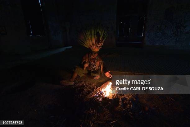 Native Korubo Isolado, from the Brazilian state of Acre, performs a ritual at the abandoned and crumbling Indian Museum complex, near the National...