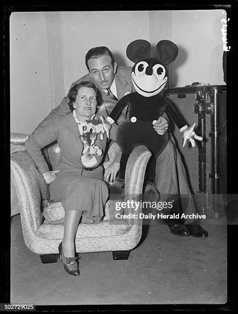 Mr and Mrs Walt Disney with Mickey Mouse, London, 21 June 1935. Walt Disney , American animator and showman, with his wife Lillian and one of his...