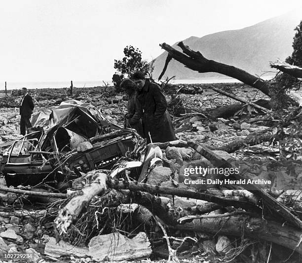 Lynmouth flood disaster, Devon, 17 August 1952. People looking over the debris left by the flood.