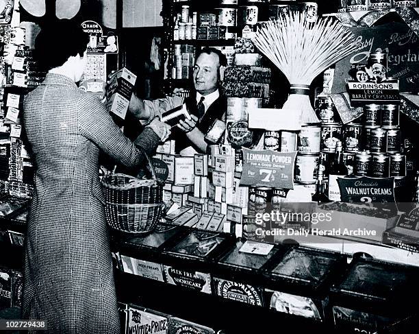 Woman buying groceries, 24 June 1937.