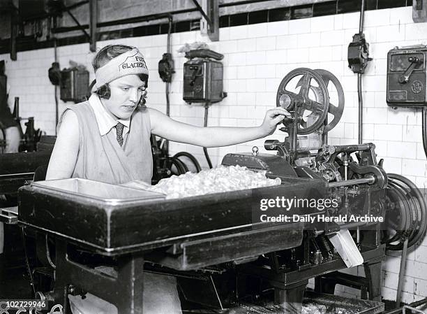 Wrapping Fox's Glacier Mints by automatic machine, 18 April, 1931. One of a series of factory workshop interiors. Photograph by Harold Tomlin.