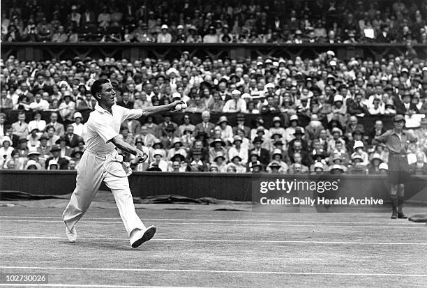 Tennis player Fred Perry in action during Wimbledon 1931. Tennis player Fred Perry in action during the Wimbledon Tennis Championship Tournament, 1...