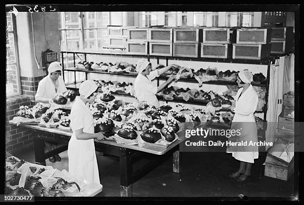 Making chocolate Easter Eggs, 1933. A photograph of workers wrapping chocolate Easter Eggs at the Cadbury Brothers Ltd factory in Bourneville, West...