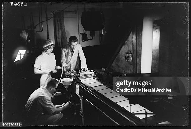 Making photographic plates, 20 November 1933. A photograph of the manufacture of glass plates at the Ilford factory, taken by James Jarche for the...