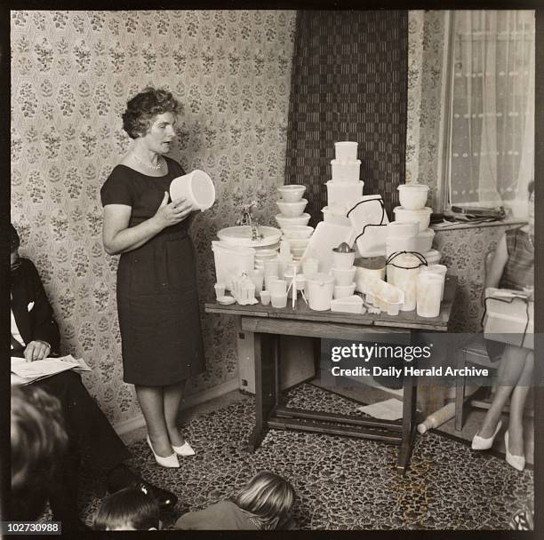 Tupperware party, 1963. Tupperware was developed by an American, Earl Tupper, in the mid 1940s. Polyethylene was discovered in 1933 by Reginald...