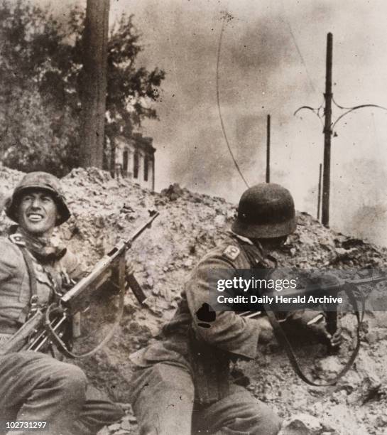 'Street fighting in Stalingrad', 1942. Gelatin silver print. A photograph taken during the siege of Stalingrad, Russia, in the Second World War. Two...