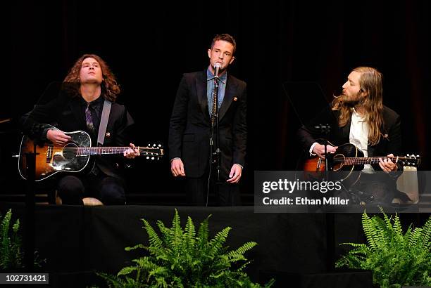 Guitarist Dave Keuning, singer Brandon Flowers and bassist Mark Stoermer of the band The Killers perform during a campaign rally for U.S. Senate...
