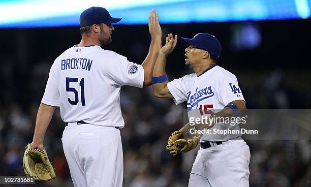Closer Jonathan Broxton and shortstop Rafael Furcal of the Los Angeles Dodgers celebrate after the game with the Chicago Cubs on July 8, 2010 at...