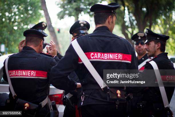 rome, italy: carabinieri officers chatting - police hat stock pictures, royalty-free photos & images