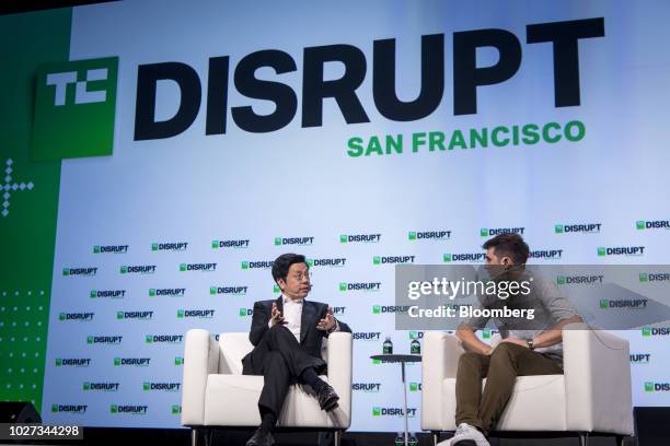 Kai-Fu Lee, chairman and chief executive officer of Sinovation Ventures, left, speaks during the TechCrunch Disrupt 2018 summit in San Francisco,...