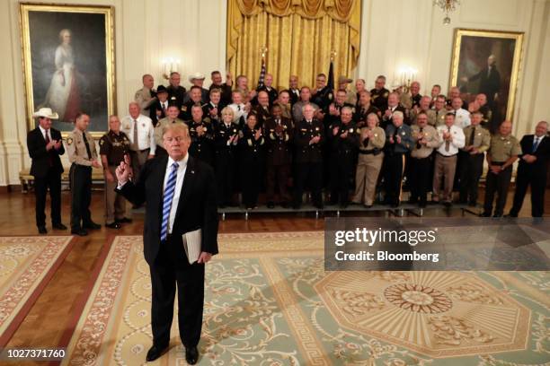 President Donald Trump speaks to members of the media during a meeting with sheriffs from across the country at the White House in Washington, D.C.,...