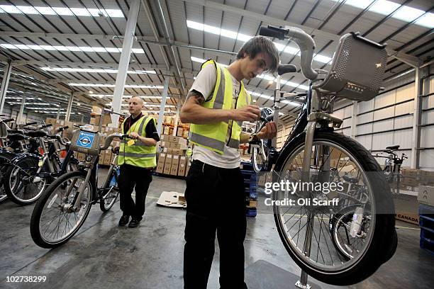 Workmen put the finishing touches to the fleet of bicycles which are to be used in London's new cycle hire scheme on July 9, 2010 in London, England....