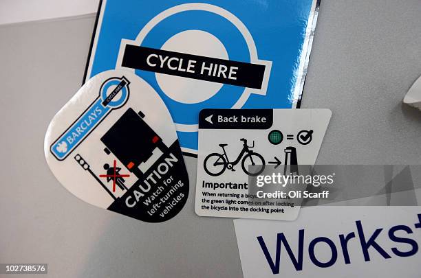 Information stickers lay on a workbench prior to attachment to bicycles which are to be used in London's new cycle hire scheme on July 9, 2010 in...