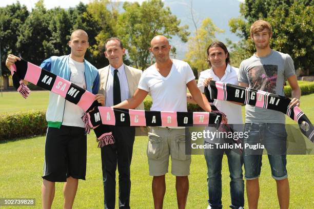 New players of US Citta di Palermo Pajtim Kasami, Massimo Maccarone and Nicola Rigoni pose with Vice President Guglielmo Micciche and Team Manager...