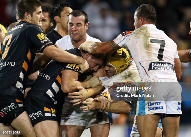 Robbie Farah of the Tigers and Nathan Friend of the Titans fight during the round 18 NRL match between the Wests Tigers and the Gold Coast Titans at...