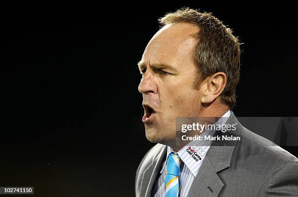 Titans coach John Cartwright shouts from the side line during the round 18 NRL match between the Wests Tigers and the Gold Coast Titans at...