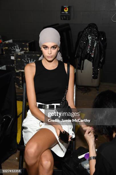 Kaia Gerber poses backstage at the Tom Ford fashion show during New York Fashion Week at Park Avenue Armory on September 5, 2018 in New York City.