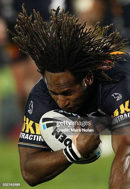 Lote Tuqiri of the Tigers is tackled during the round 18 NRL match between the Wests Tigers and the Gold Coast Titans at Campelltown Sports Stadium...