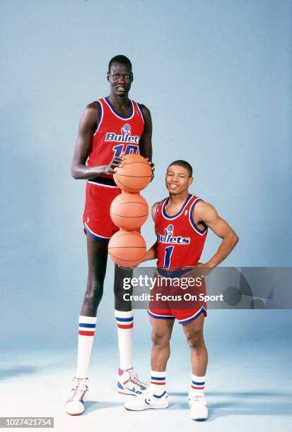 Manute Bol and Muggsy Bogues of the Washington Bullets poses together for this portrait circa 1987 at the Capital Centre in Landover, Maryland. Bol...