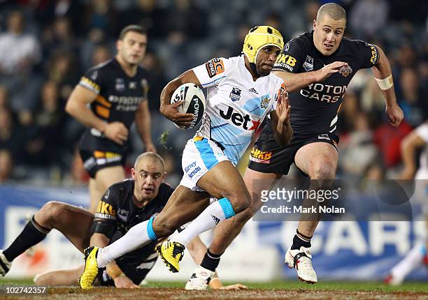 Preston Campbell of the Titans makes a line break during the round 18 NRL match between the Wests Tigers and the Gold Coast Titans at Campelltown...