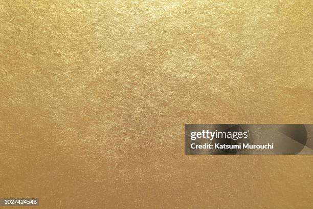 golden foil paper texture background - gold foil texture foto e immagini stock