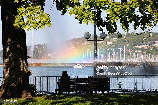 Park on Lake Geneva with the yachting harbour and the fountain Jet d'Eau with a rainbow on April 28, 2010 in Geneva, Switzerland. Geneva is the...