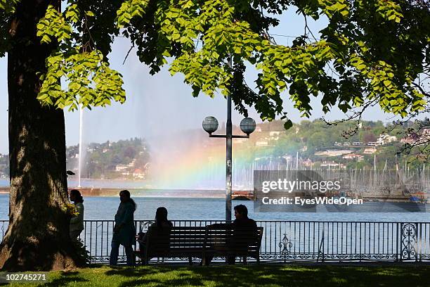 Lake Geneva with the yachting harbour and the fountain Jet d'Eau with a rainbow on April 28, 2010 in Geneva, Switzerland. Geneva is the capital of...