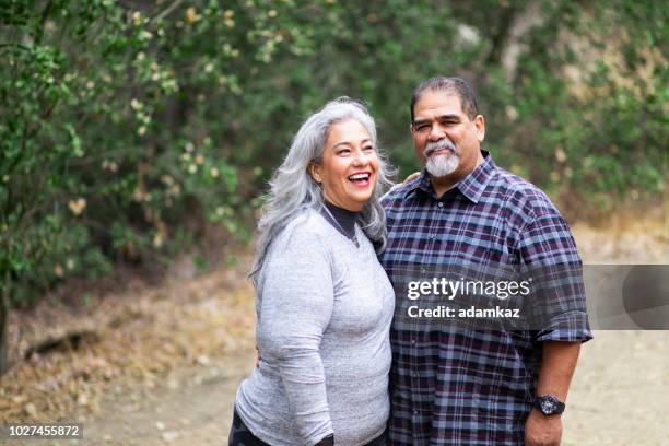 senior mexican couple in nature - fat couple stock pictures, royalty-free photos & images