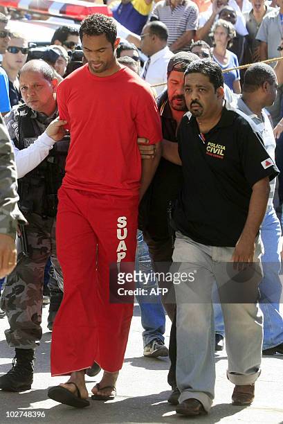 Brazilian footballer Bruno Fernandes de Souza is taken under custody to the presidium of Belo Horizonte, Brazil, on July 9, 2010. De Sousa, a star...