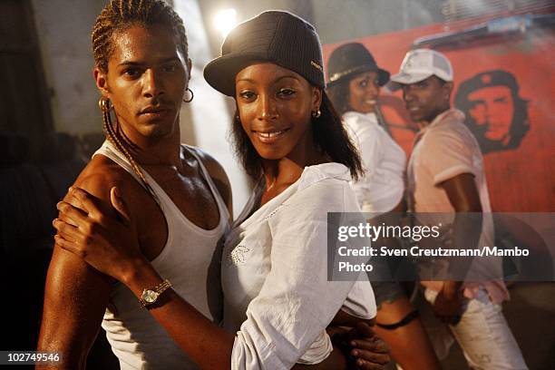 Cuban dancers of the KINGS OF SALSA, a show by british theater director Jon Lee, rehearse during a photoshoot in a garage against the backdrop of the...