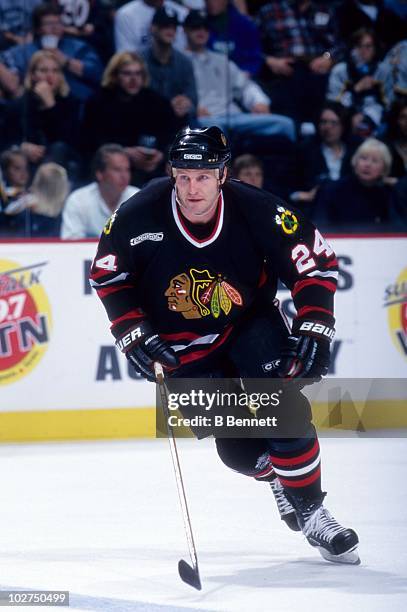 Bob Probert of the Chicago Blackhawks skates on the ice during an NHL game circa 2000.