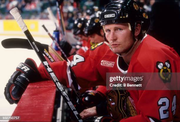 Bob Probert of the Chicago Blackhawks sits on the bench during an NHL game circa February, 2000.