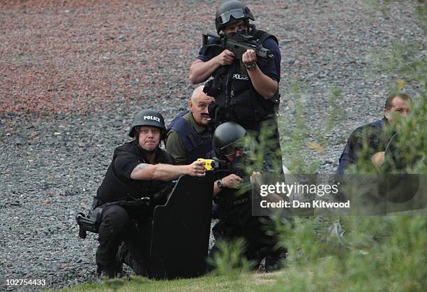 Police negotiate with a man fitting the description of fugitive gunman Raoul Moat on July 9, 2010 in Rothbury, England. Police are negotiating with a...