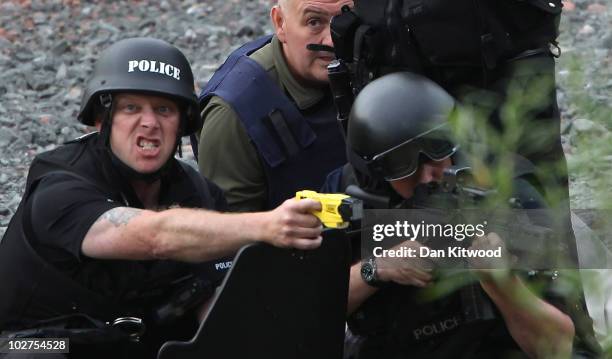 Police negotiate with a man fitting the description of fugitive gunman Raoul Moat on July 9, 2010 in Rothbury, England. Police are negotiating with a...