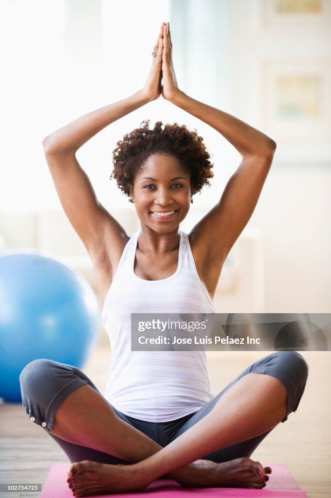 Black woman practicing yoga