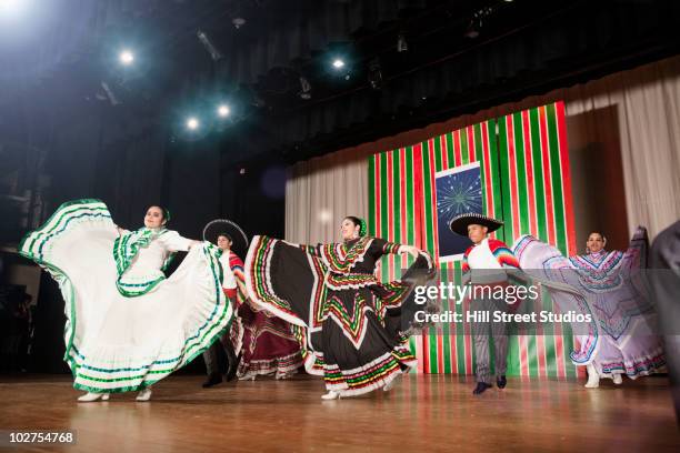 students performing mexican folk dance on stage - theatre costume stock pictures, royalty-free photos & images