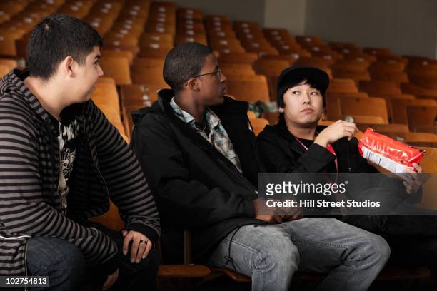 students sitting in high school auditorium - native korean 個照片及圖片檔