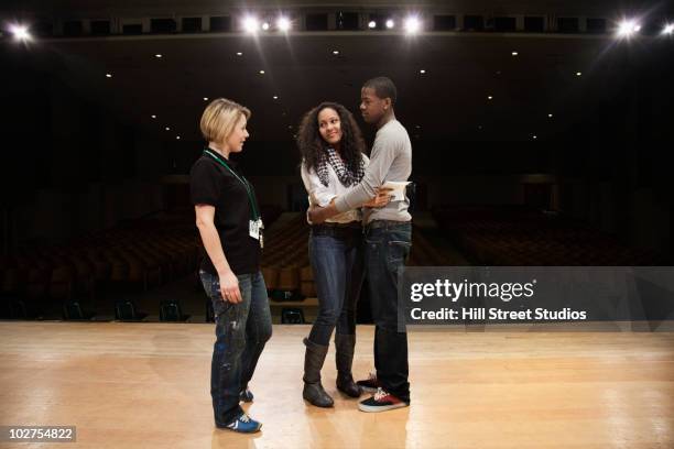 students rehearsing onstage - student on stage stock pictures, royalty-free photos & images