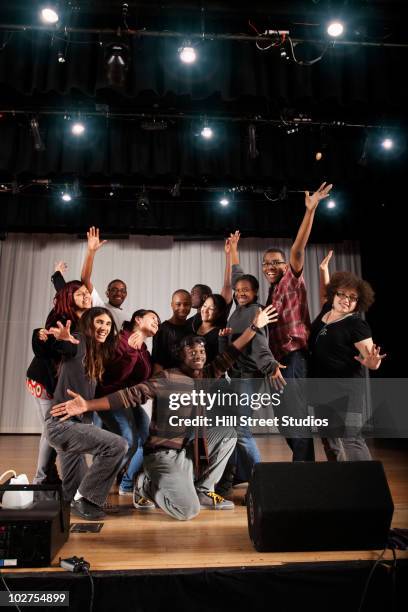 students bowing on high school stage - bowing_(social) stock pictures, royalty-free photos & images